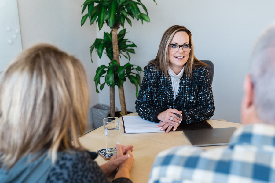 Samantha with couple at table in retirement meeting
